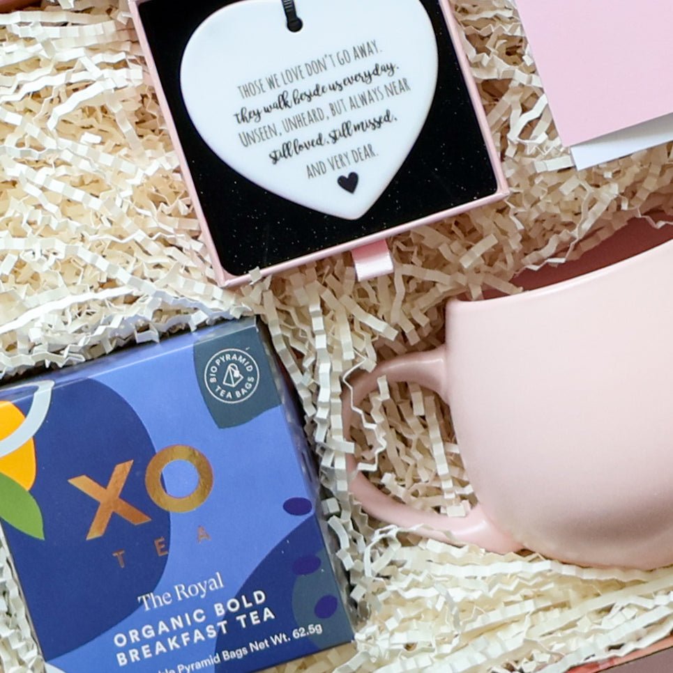 With Sympathy gift box detail showing XO Tea organic breakfast tea pink tulip mug and ceramic heart keepsake poem Perth