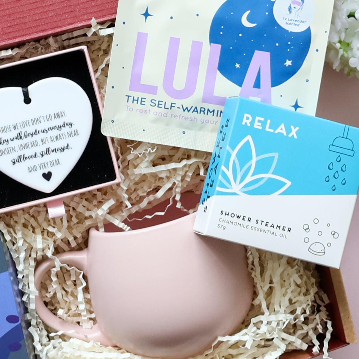 With Sympathy gift box detail showing ceramic heart keepsake poem Lula self warming eye mask Relax chamomile shower steamer and pink tulip mug Perth