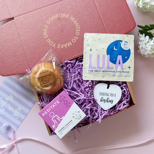 Mini Big Hug Care Package Perth open showing loaded cookie shower steamer warming eye mask and Sending You a Big Hug ceramic heart keepsake