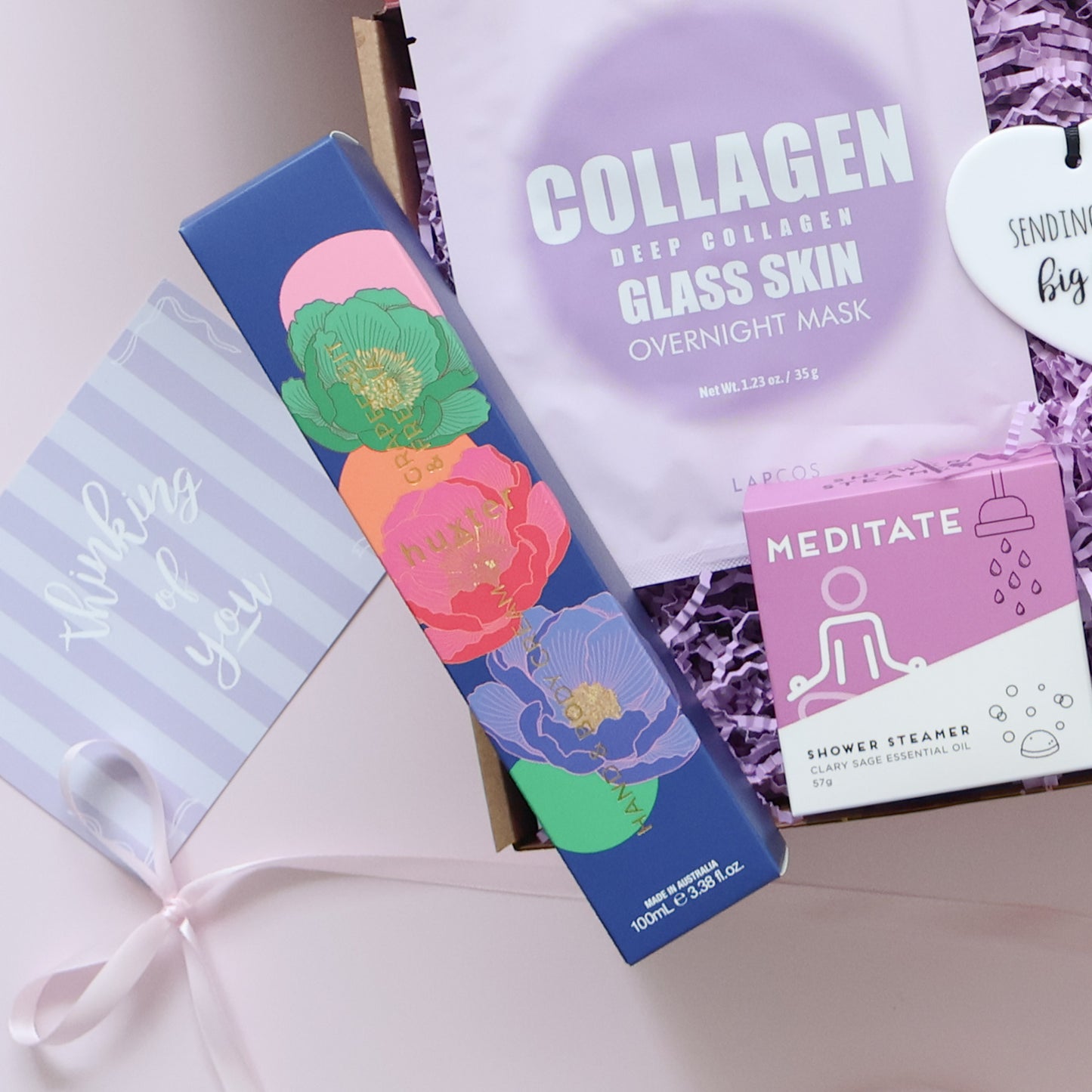Pamper Gift box showing hand body cream Lapcos overnight mask shower steamer