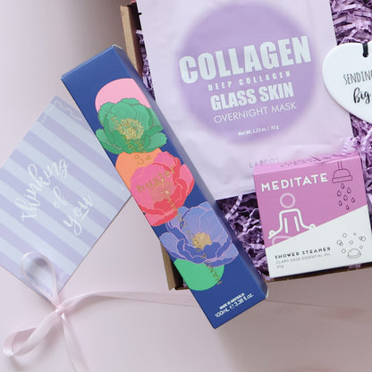 Pamper Gift box showing hand body cream Lapcos overnight mask shower steamer