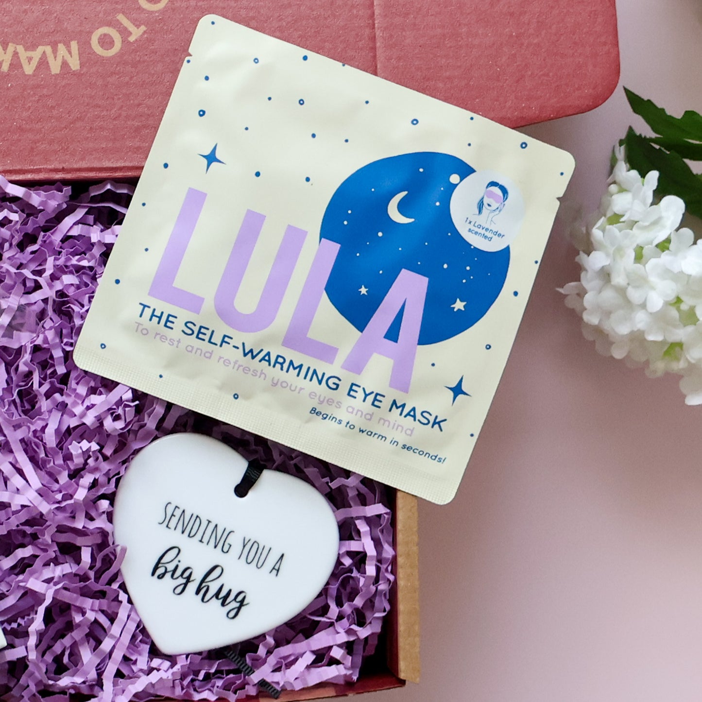 Mini Big Hug Care Package showing Lula self warming lavender eye mask and Sending You a Big Hug ceramic heart keepsake