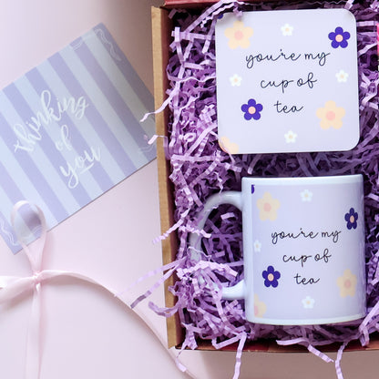 Care Package showing matching You're My Cup of Tea mug and coaster set with purple daisy design