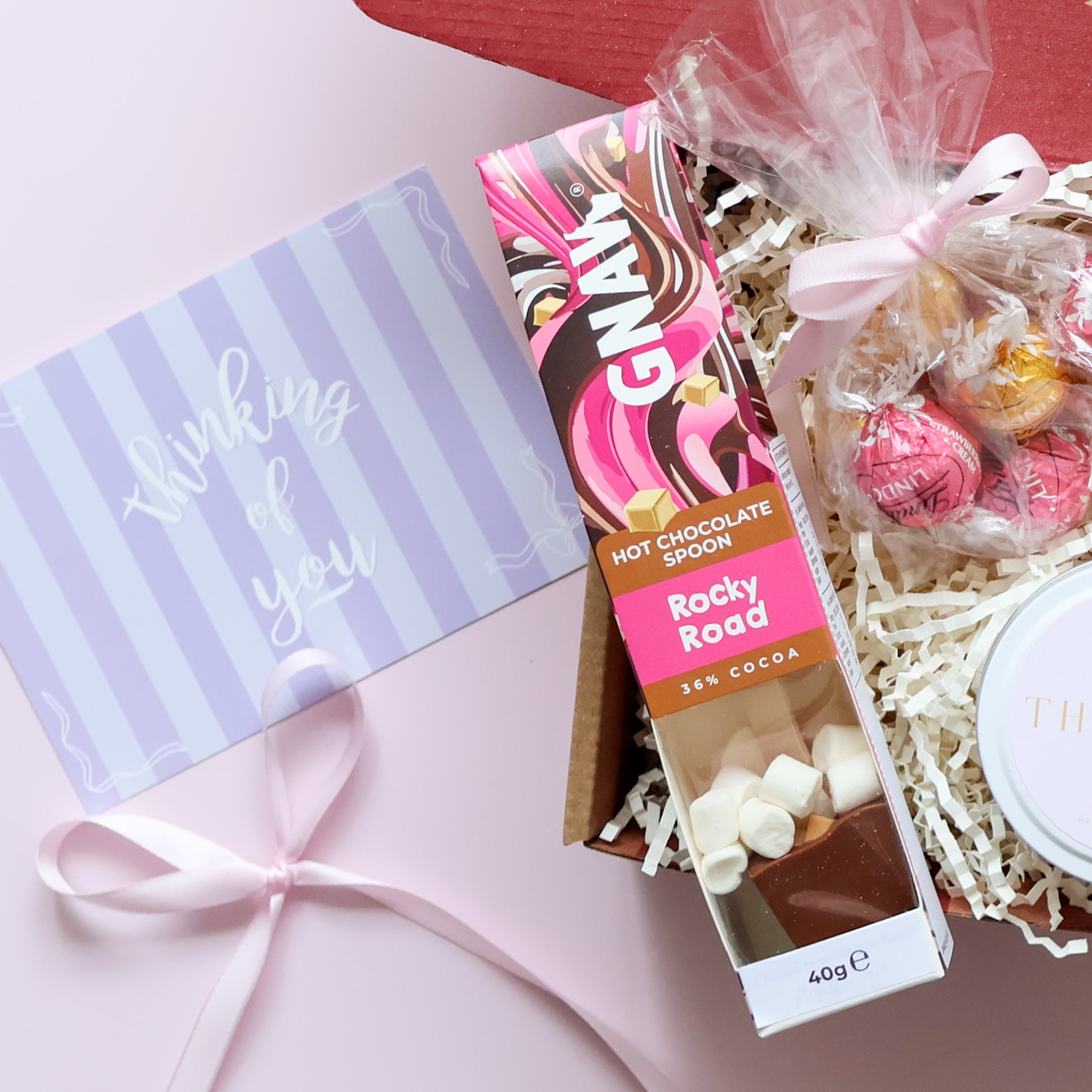 Sending You Comfort gift hamper detail showing Lapcos Pearl brightening face mask and Thinking of You soy candle tin