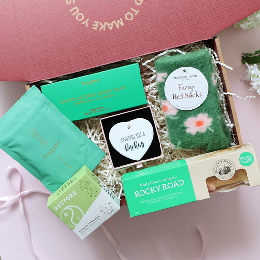 Thinking of you pamper box with Huxter body bar fuzzy bed socks rocky road and Big Hug ceramic keepsake