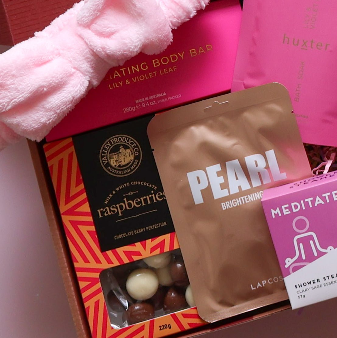 Pamper hamper for her with bath soak, body bar, face mask, shower steamer, headband and chocolate raspberries