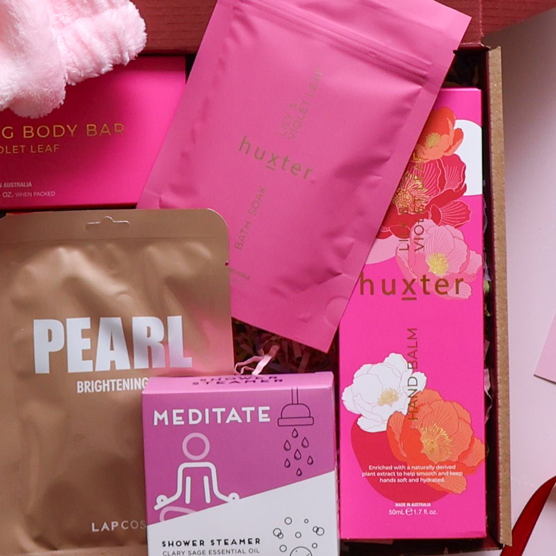 Pamper hamper for her with bath soak, body bar, hand balm, face mask, and shower steamer