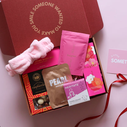 Pamper hamper for her with bath soak, body bar, hand balm, face mask, shower steamer, headband and chocolate raspberries